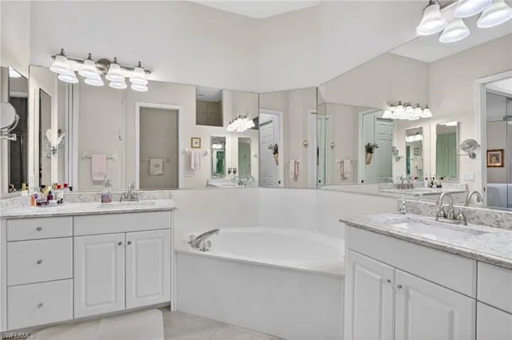 Primary bathroom has spa tub and shower