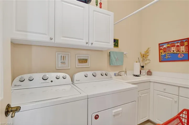 Laundry area with cabinet space and washer and dryer