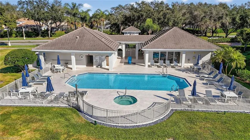 Seville pool featuring a large pool long enough for laps, hot tub, fitness room and meeting/party room