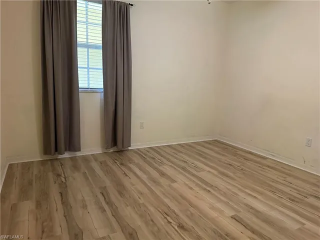 Unfurnished room featuring light wood-type flooring