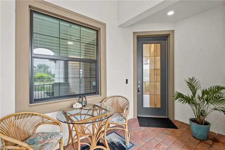 Property entrance featuring stucco siding