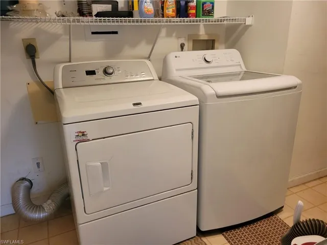 Large laundry room with newer washing machine
