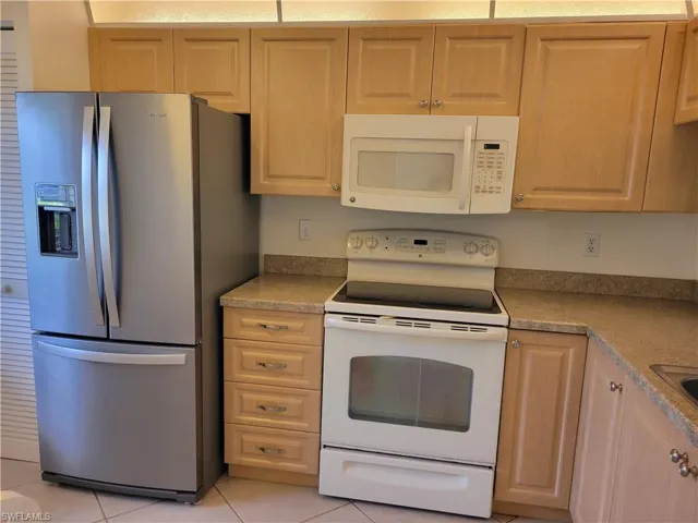Refaced cabinets and new refrigerator