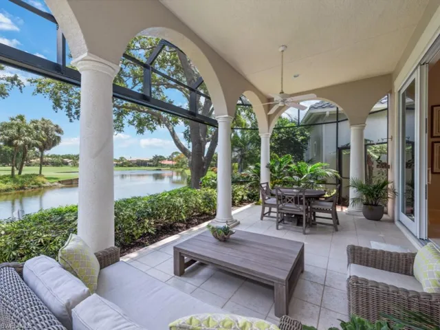 Lanai with picture window cage, water and golf views