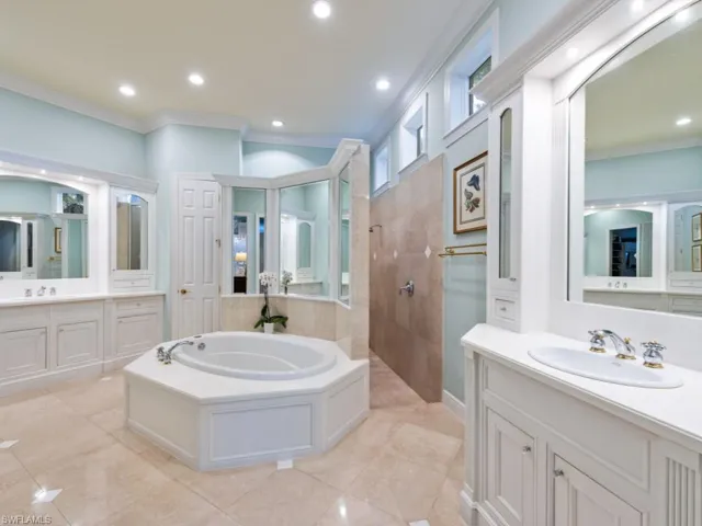 Primary bathroom with shower, soaking tub, dual vanities