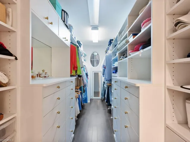 Walk in closet in primary bedroom