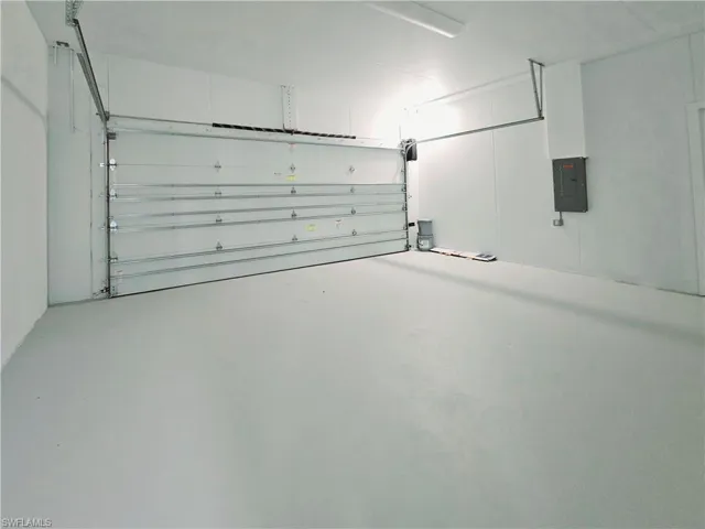 Garage featuring electric panel