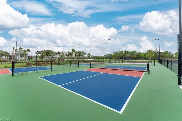 View of tennis court with community basketball court