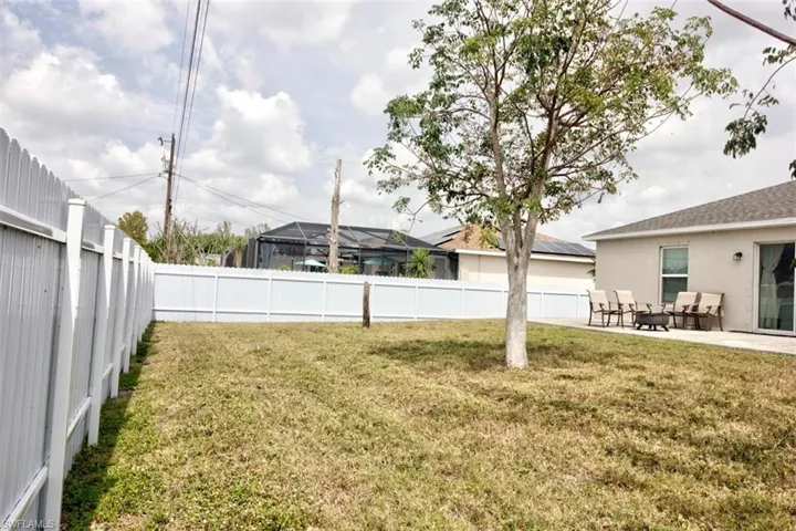 View of yard with a patio and a fenced backyard