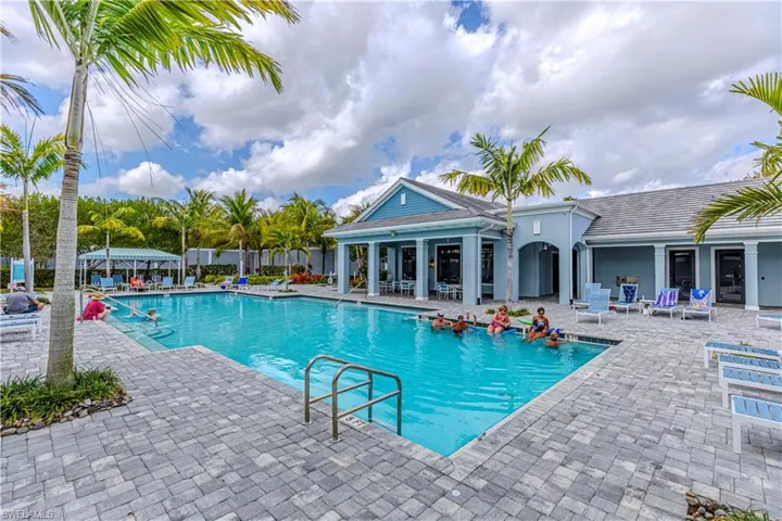 Community pool featuring a patio