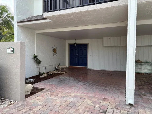 Covered carport and small storage cabinet