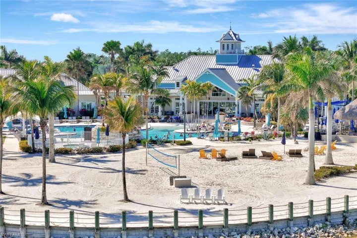 View of jungle gym featuring a patio area, a community pool, and fence
