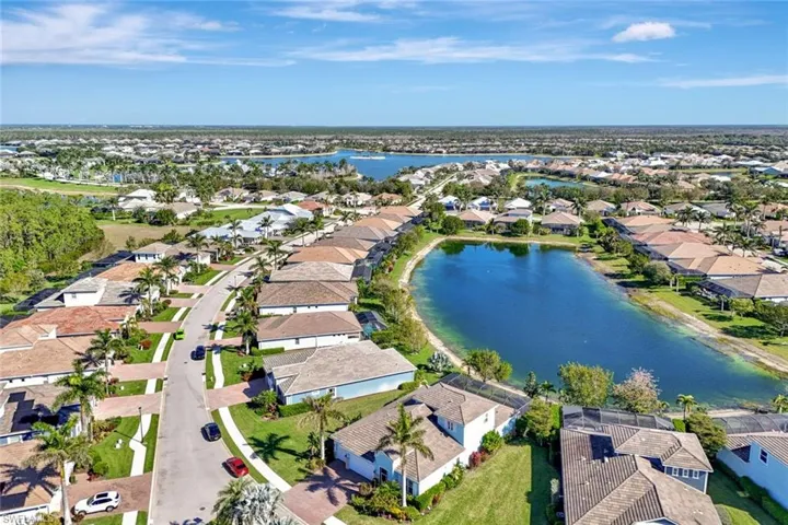 Aerial view featuring a water view and a residential view