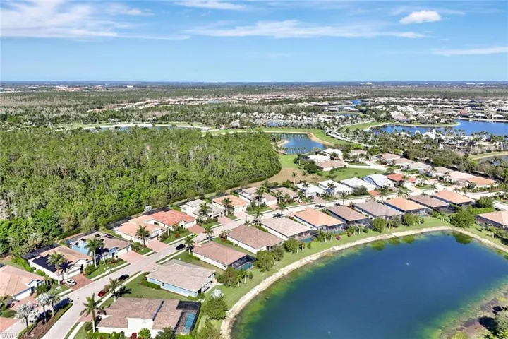 Drone / aerial view featuring a water view and a residential view