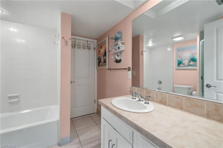 Second Full bathroom featuring crown molding and separate shower