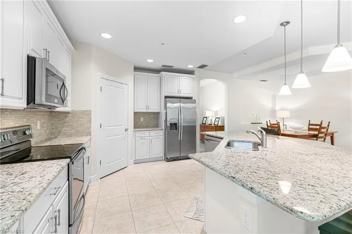 THE HOME SIMPLY GLOWS WITH SPECTACULAR GRANITE COUNTERTOPS & UPDATED LIGHTING!
