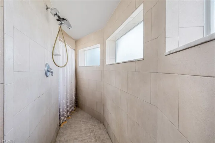 Full bathroom featuring tiled shower