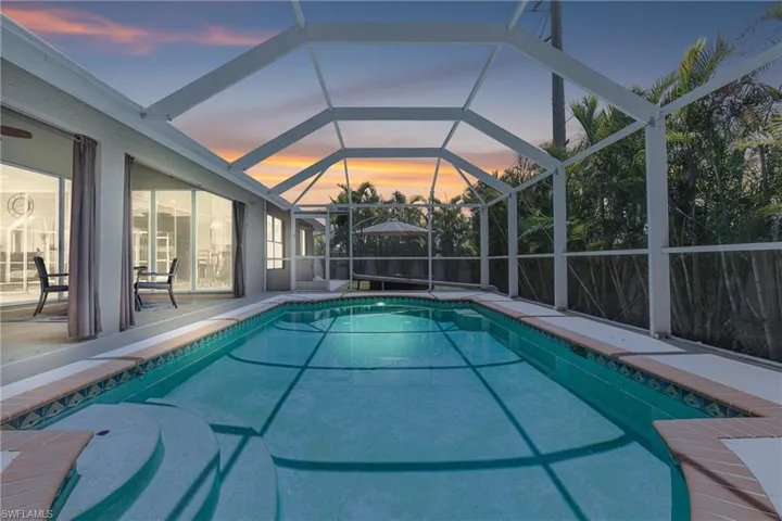 Pool with a lanai and a patio