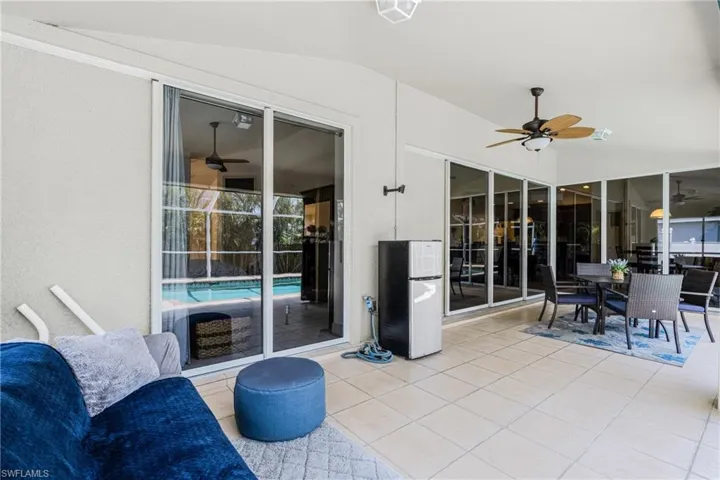 View of patio / terrace featuring outdoor dining area, an outdoor pool, and a ceiling fan