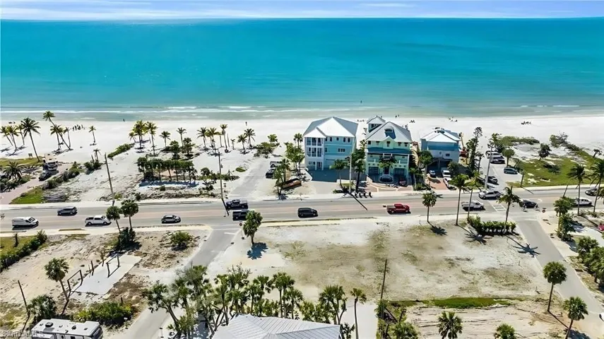 Drone / aerial view with a water view and a view of the beach VIRTUALLY EDITED