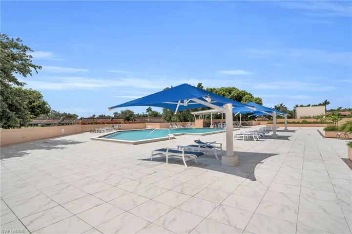 Community pool featuring a patio