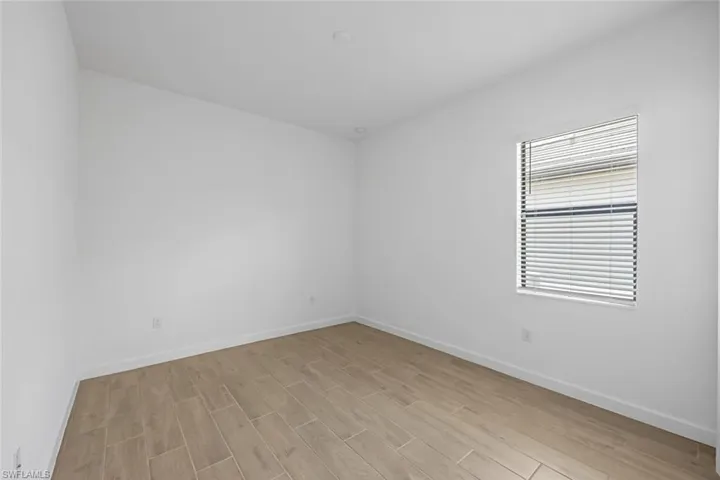 Unfurnished room featuring light hardwood / wood-style flooring
