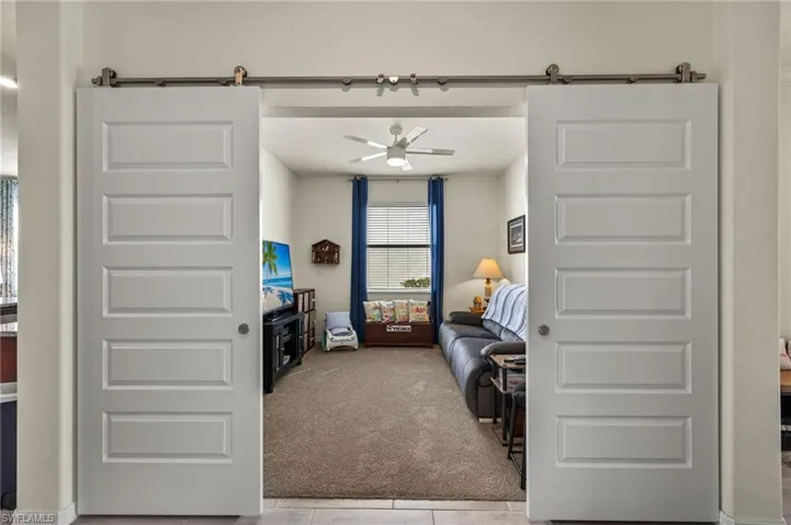 Barn-Style Doors allowing for privacy in the Den that can easily be converted to an office or fourth bedroom
