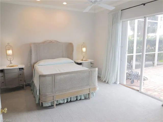 Carpeted room featuring a ceiling fan, recessed lighting, and crown molding