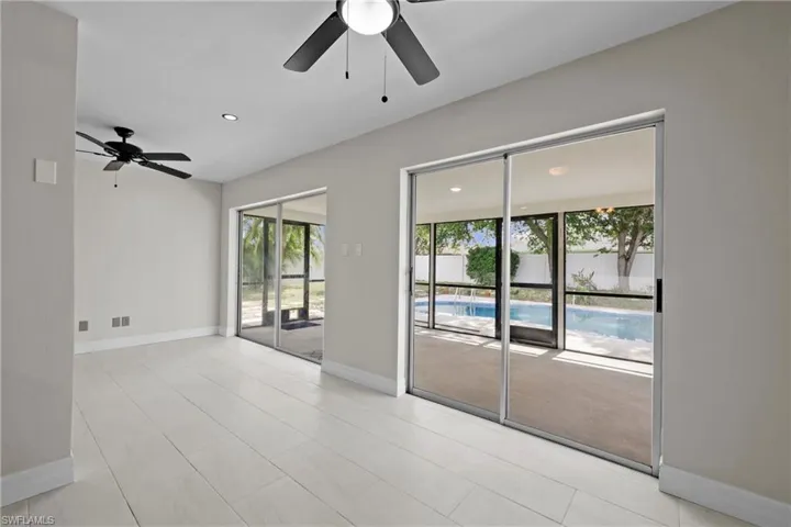 Empty room with a ceiling fan and recessed lighting