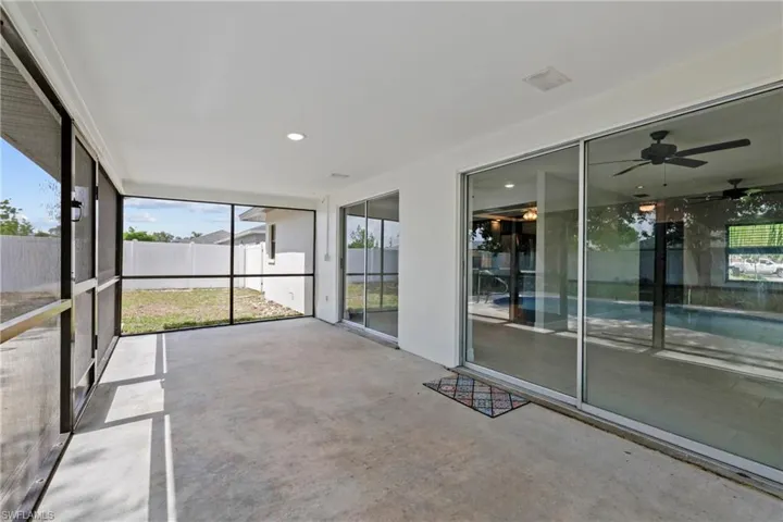 Unfurnished sunroom with a ceiling fan