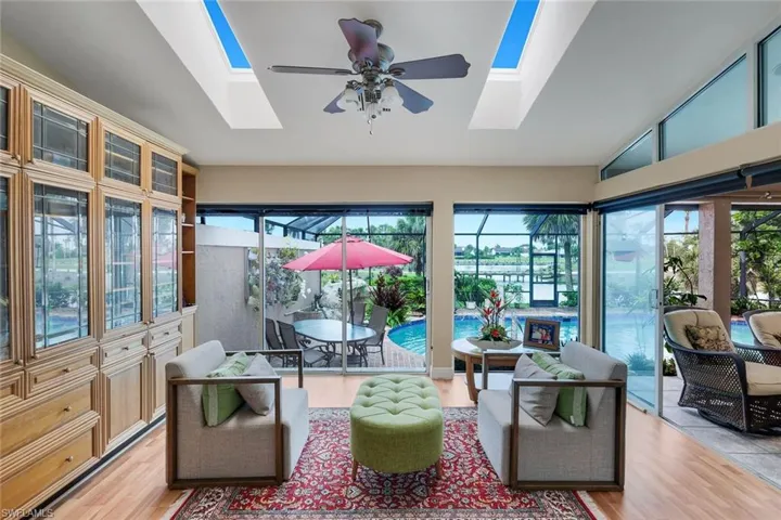 Located In the Primary Bedroom, Custom Built Ins, Glassed Living Area, Opens to Lanai, Skylights, Luxury Vinyl Tile Flooring
