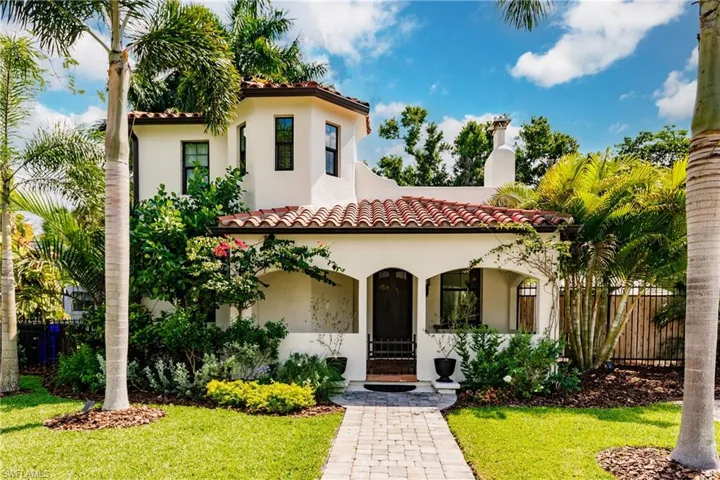 Mediterranean / spanish-style home with a front yard