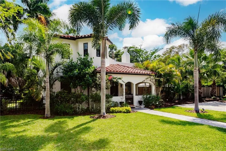 Mediterranean / spanish-style house with a front yard