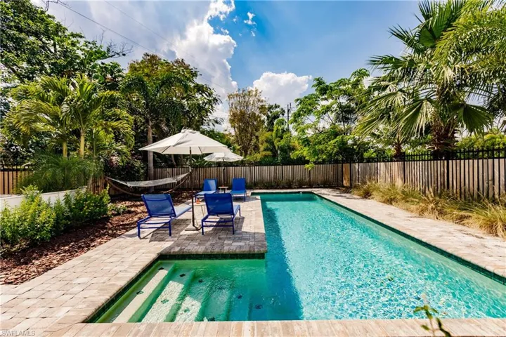 View of swimming pool with a patio area