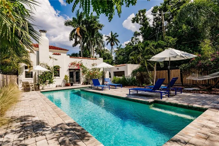 View of swimming pool with a patio and french doors