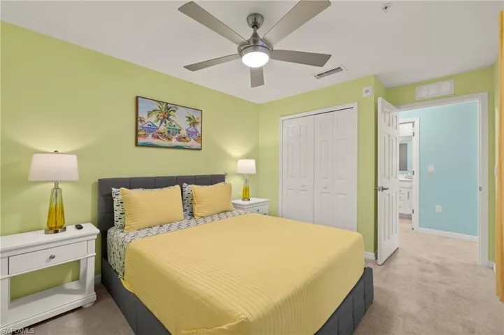 Bedroom with carpet flooring, a closet, baseboards, and ceiling fan