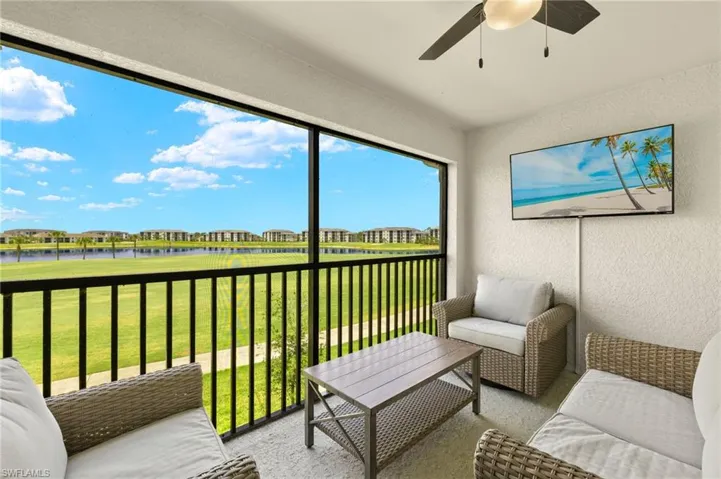 Sunroom with a ceiling fan and outdoor lounge area