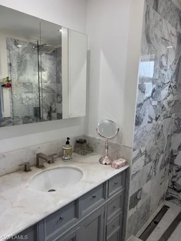 Bathroom with vanity and walk in shower