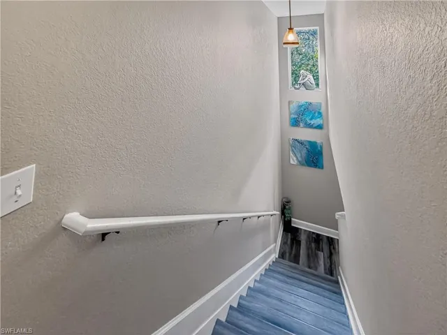 Staircase with a textured wall