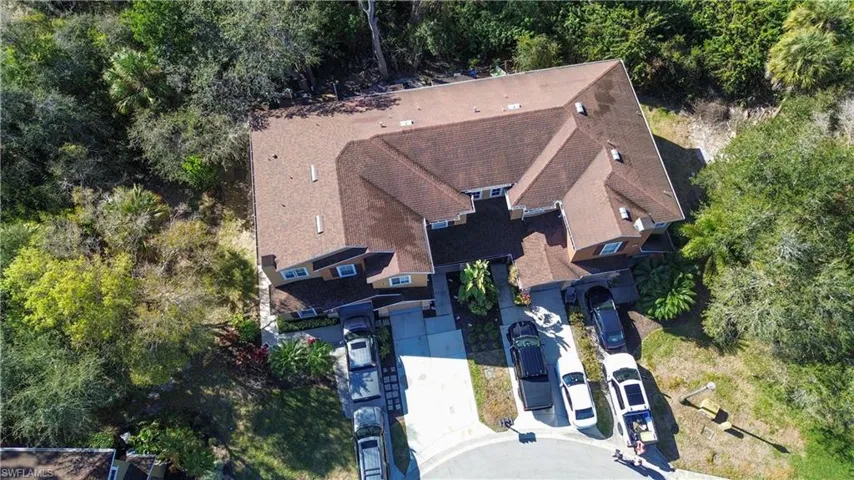 Aerial overview of property's location featuring a tree filled landscape