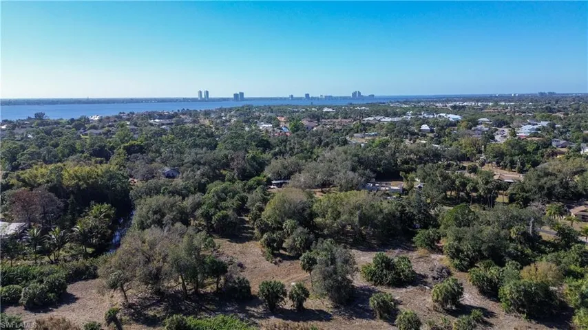 Aerial view of property's location featuring city skyline