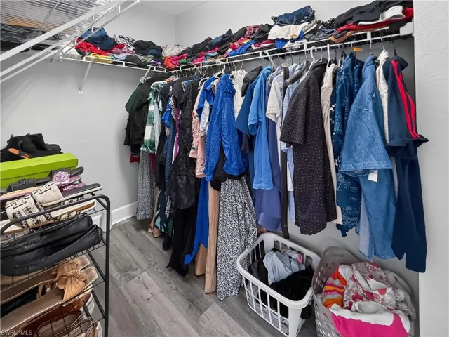 Walk in closet featuring light wood finished floors