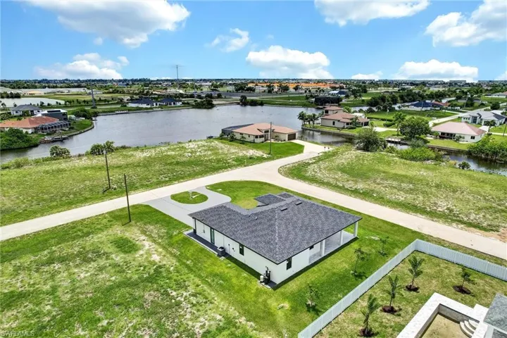 Aerial view of residential area featuring a large body of water