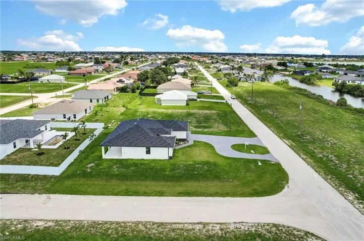 Aerial view of residential area with a large body of water