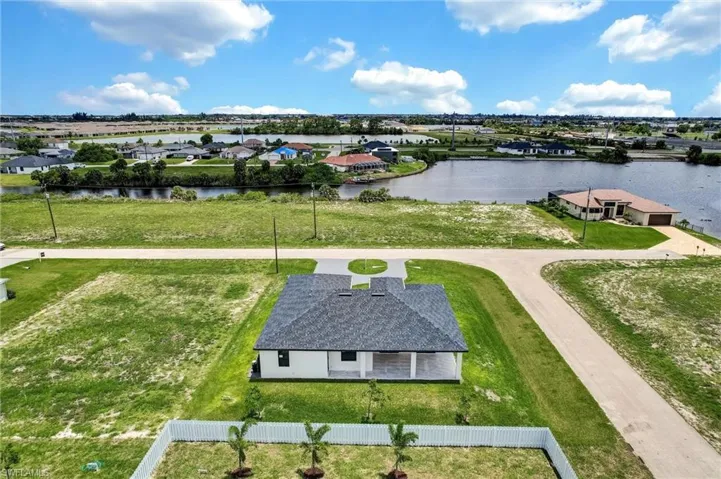 Aerial view of residential area with a large body of water