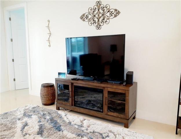 TV console doubles as a real heat producing fire place.