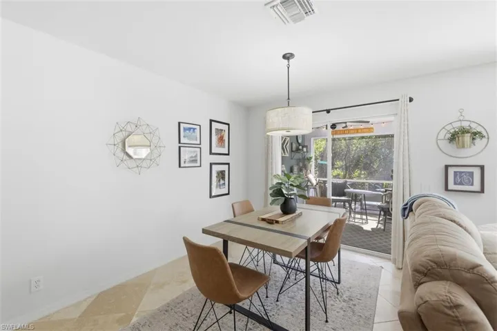 Dining room featuring ceiling fan and light tile patterned flooring