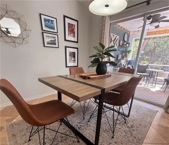Dining room featuring ceiling fan and light tile patterned flooring
