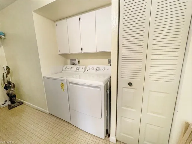Laundry room with cabinet space and separate washer and dryer