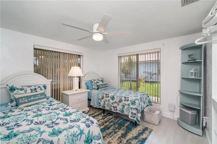 Bedroom featuring access to outside and ceiling fan